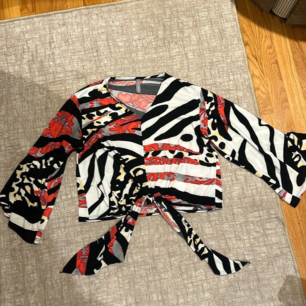 Last Tango patterned blouse. Flowy sleeves and tie at bottom near waist.